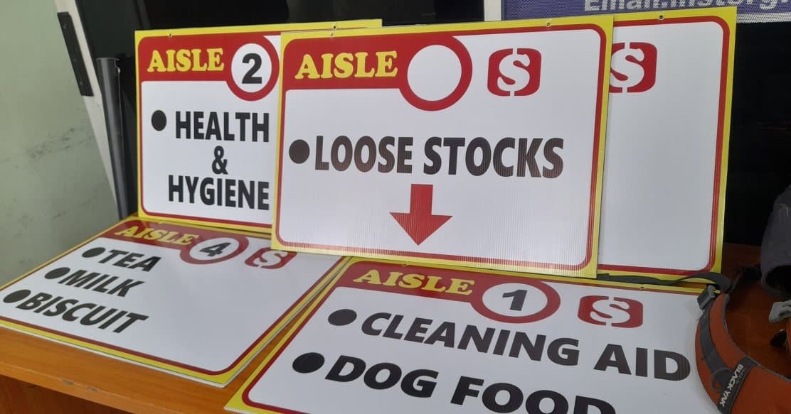 Printed aisle and category signage ready for installation