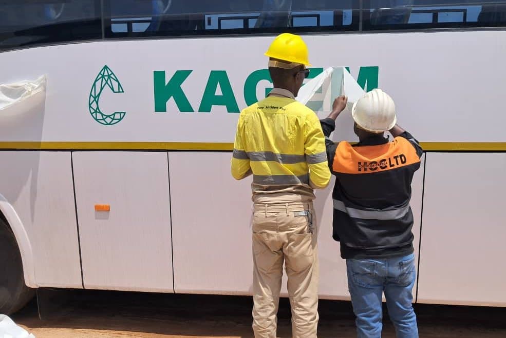 Vinyl lettering applied to the side of a KAGEM Mining bus