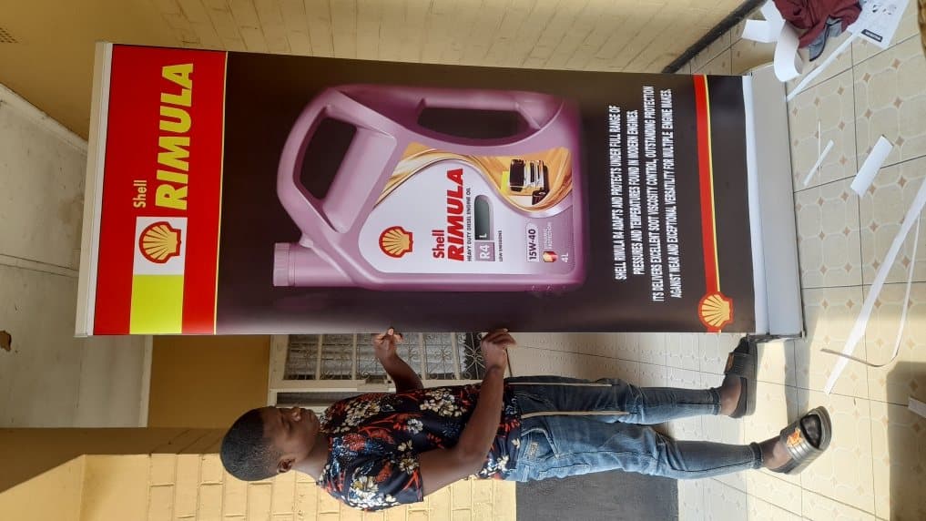 Shell Rimula roll-up banner being assembled