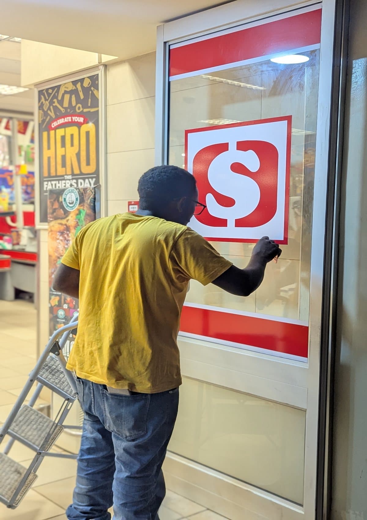 Shoprite entrance sign being fitted