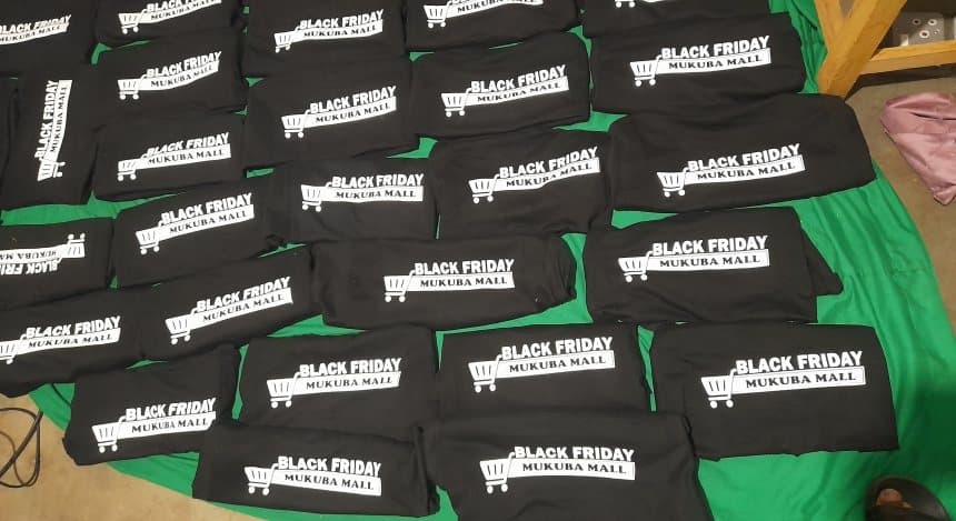 Printed Black Friday t-shirts folded and packed for delivery